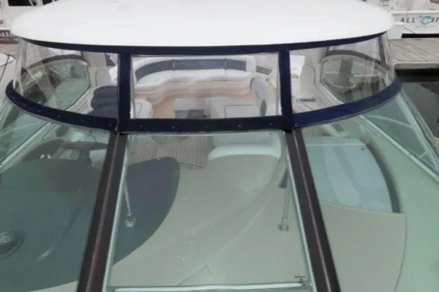 Slide: The Image of 2005 Sea Ray 500 Sundancer yacht with sleek glass windshield and luxurious interior view. - 4