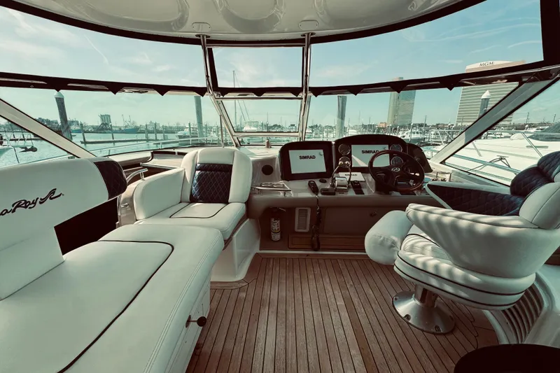 Slide: The Image of Luxurious 2005 Sea Ray 500 Sundancer yacht interior with helm and seating area. - 6