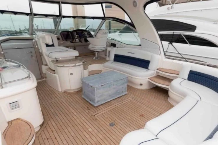 Slide: The Image of Luxurious 2005 Sea Ray 500 Sundancer yacht interior with elegant seating and wooden flooring. - 7