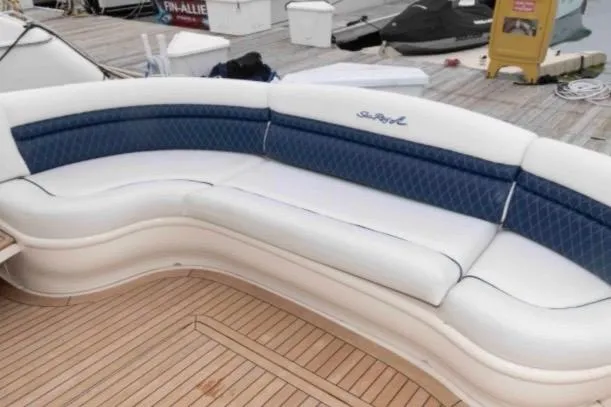 Slide: The Image of Luxurious seating on 2005 Sea Ray 500 Sundancer yacht with elegant blue and white upholstery. - 9