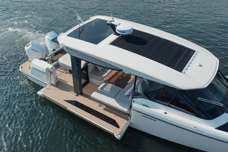 Slide: The Image of 2026 Saxdor 400 GTC luxury boat on water, featuring sleek design and modern amenities. - 3