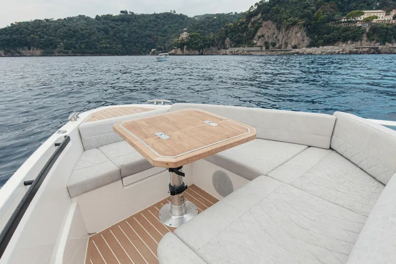 Slide: The Image of Luxurious Saxdor 400 GTC boat interior with seating and table, 2026 model, scenic ocean view. - 5