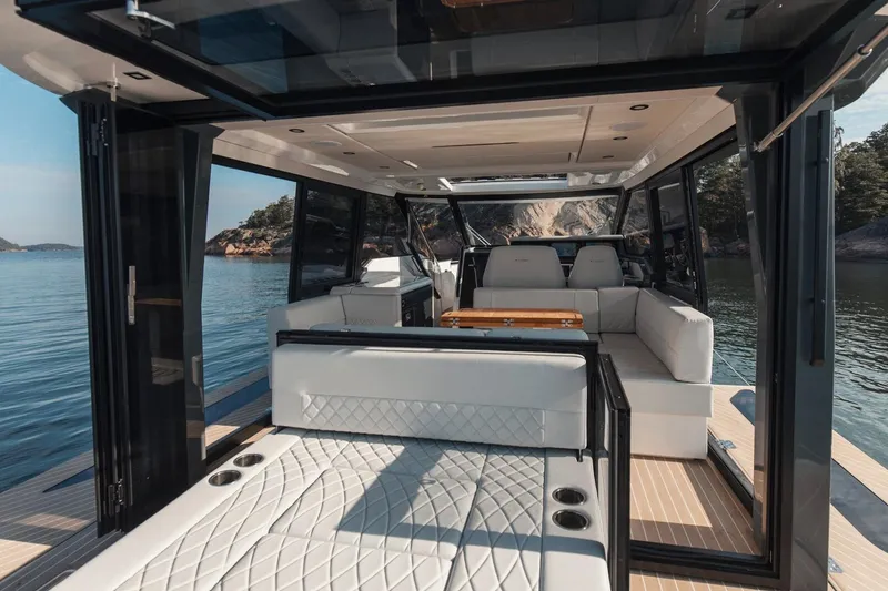 Slide: The Image of Luxurious interior of 2026 Saxdor 400 GTC yacht with elegant seating and scenic water view. - 8