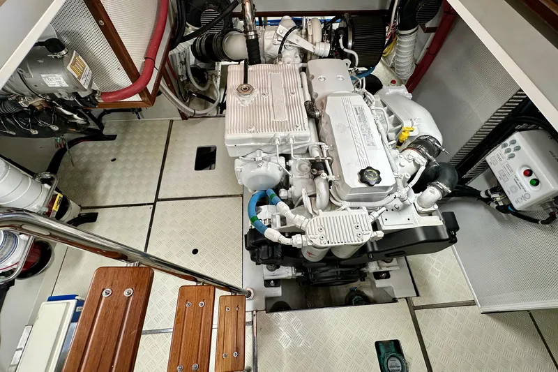 Slide: The Image of Engine room of 2016 Helmsman Trawlers 38 Pilothouse, showcasing detailed machinery and components. - 27