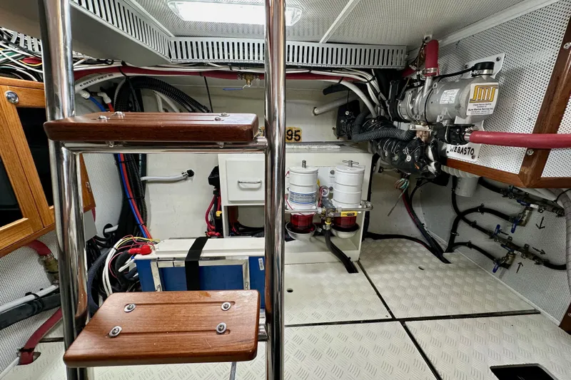 Slide: The Image of Engine room of 2016 Helmsman Trawlers 38 Pilothouse with equipment and wiring. - 28