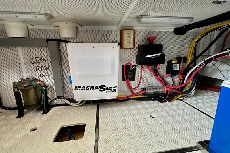 Slide: The Image of Engine room of 2016 Helmsman Trawlers 38 Pilothouse with electrical components and wiring. - 30