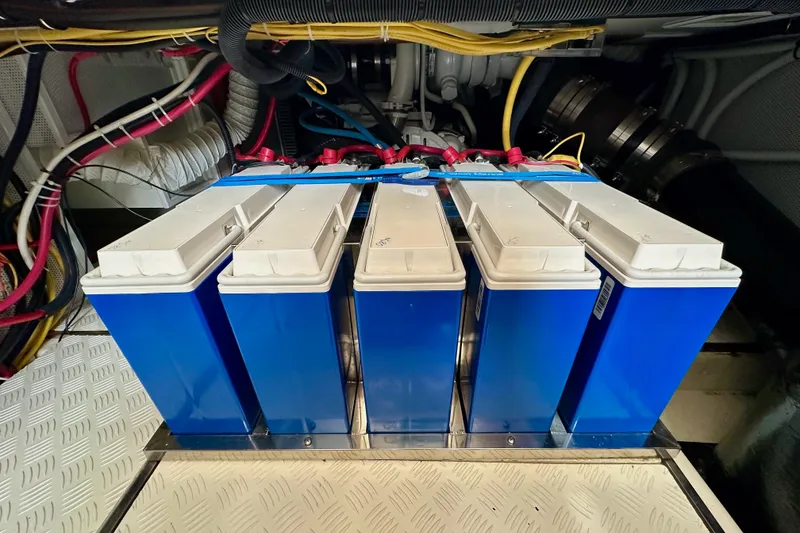 Slide: The Image of Battery compartment of a 2016 Helmsman Trawlers 38 Pilothouse with blue battery units. - 31