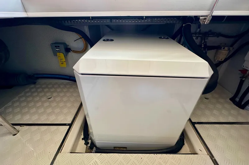 Slide: The Image of Engine compartment of 2016 Helmsman Trawlers 38 Pilothouse with machinery and wiring. - 32