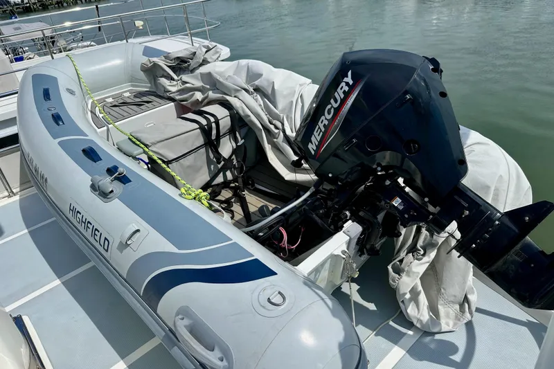 Slide: The Image of Inflatable boat with Mercury outboard motor on 2016 Helmsman Trawlers 38 Pilothouse. - 39