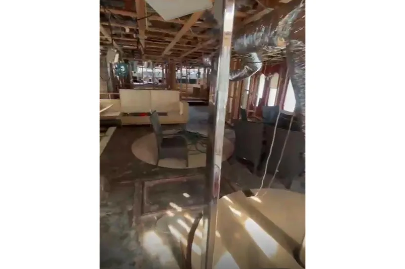 Slide: The Image of Interior of 1985 Sterling Yachts 155 Motor Yacht under renovation, showing exposed framework. - 11