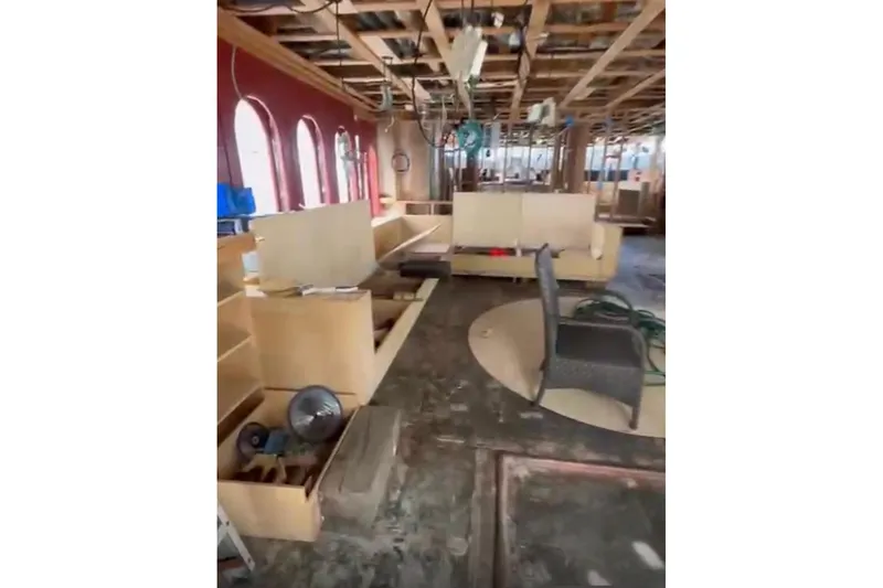Slide: The Image of Interior renovation of 1985 Sterling Yachts 155 Motor Yacht, featuring unfinished woodwork and seating. - 12