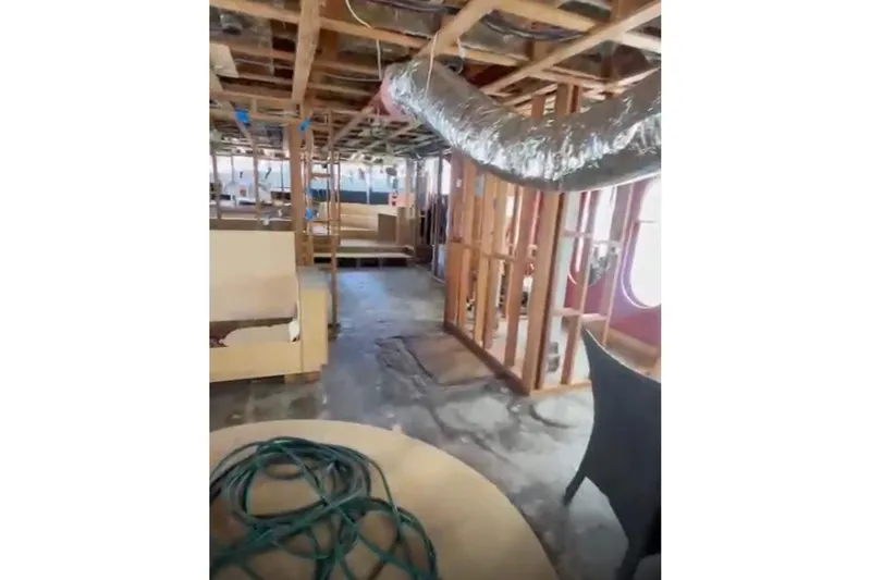 Slide: The Image of Interior renovation of 1985 Sterling Yachts 155 Motor Yacht, showing exposed framework and ductwork. - 14