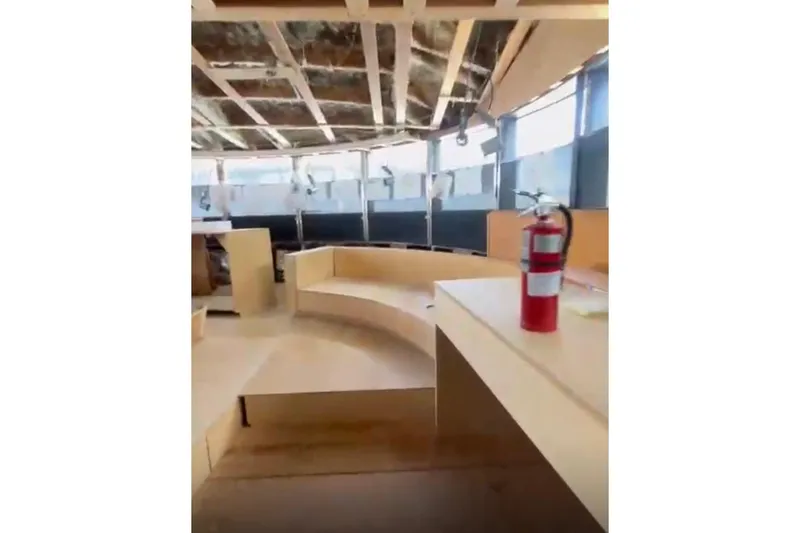 Slide: The Image of Interior of 1985 Sterling Yachts 155 Motor Yacht with modern seating and fire extinguisher. - 18