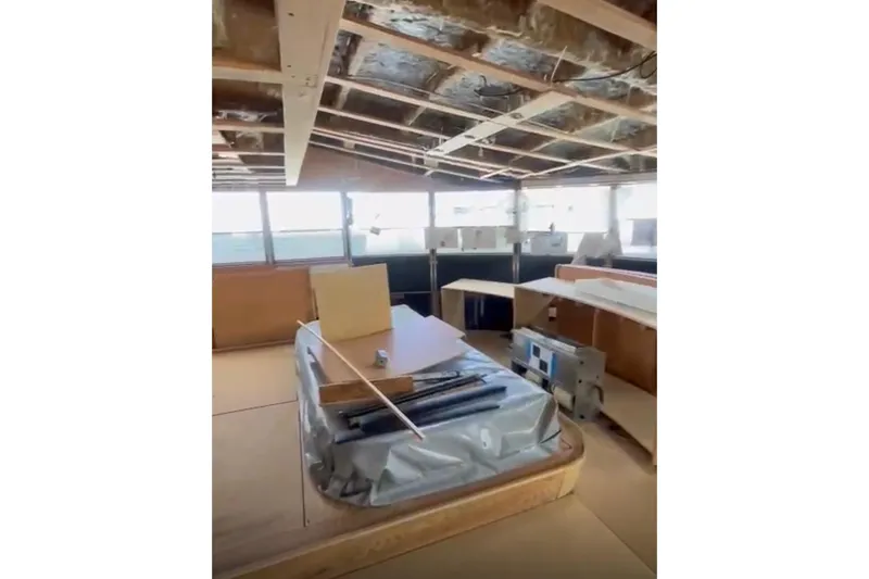 Slide: The Image of Interior of 1985 Sterling Yachts 155 Motor Yacht under renovation, showcasing unfinished woodwork. - 20