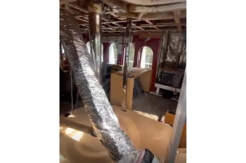 Slide: The Image of Interior renovation of 1985 Sterling Yachts 155 Motor Yacht, showing exposed ducts and framework. - 22