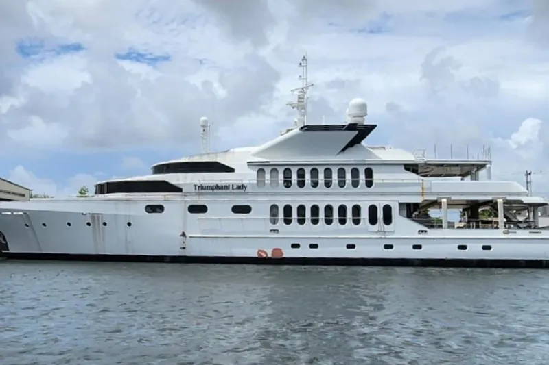 Slide: The Image of 1985 Sterling Yachts 155 Motor Yacht on water, cloudy sky background. - 23