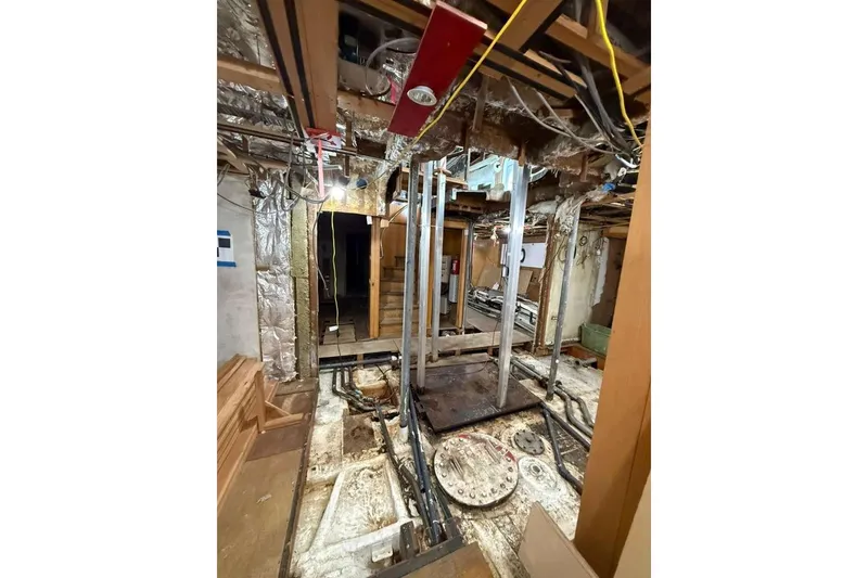 Slide: The Image of Engine room of a 1985 Sterling Yachts 155 Motor Yacht, showing mechanical components. - 25
