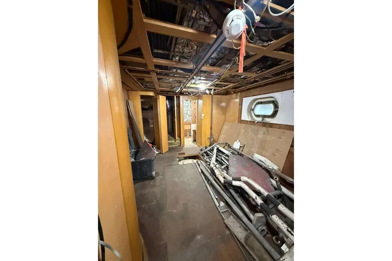 Slide: The Image of Interior of 1985 Sterling Yachts 155 Motor Yacht under renovation, showing exposed framework and materials. - 27