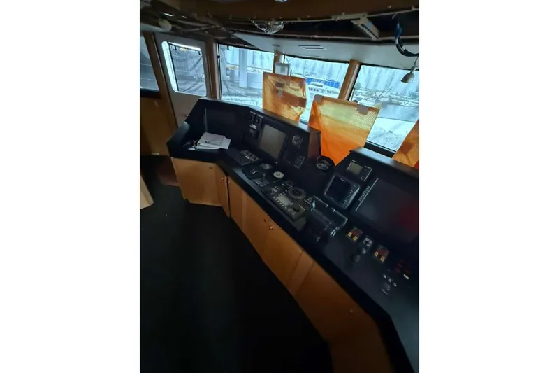 Slide: The Image of Bridge of 1985 Sterling Yachts 155 Motor Yacht with navigation equipment. - 29