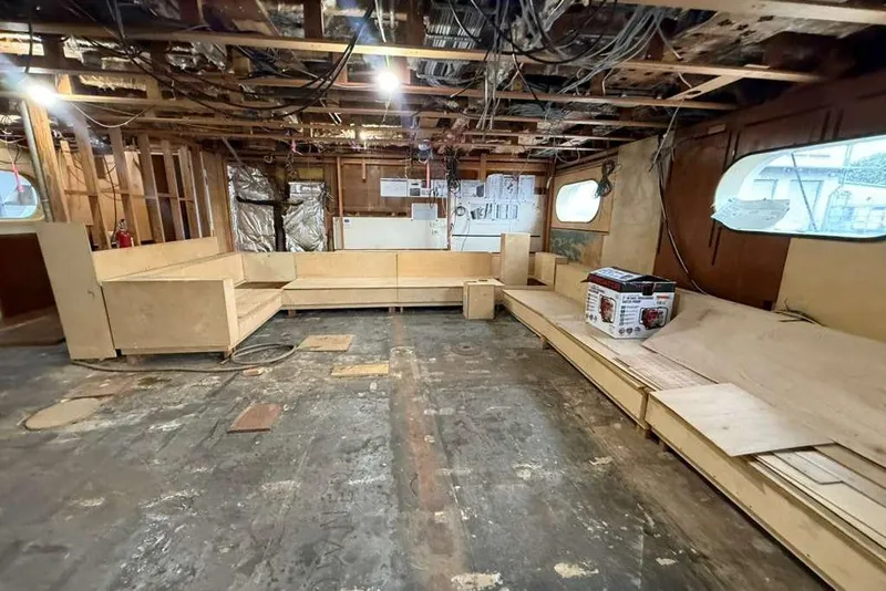 Slide: The Image of Interior renovation of 1985 Sterling Yachts 155 Motor Yacht, showing unfinished wooden framework. - 30
