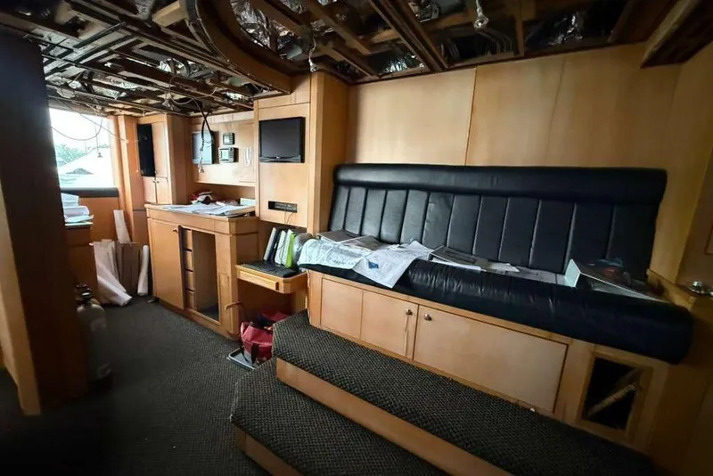Slide: The Image of Interior of 1985 Sterling Yachts 155 Motor Yacht with leather seating and wooden cabinetry. - 31