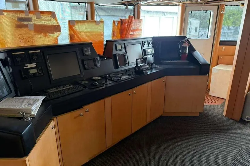 Slide: The Image of Control room of a 1985 Sterling Yachts 155 Motor Yacht with navigation equipment. - 33