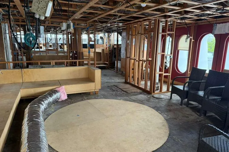 Slide: The Image of Interior of 1985 Sterling Yachts 155 Motor Yacht under renovation, featuring exposed framework. - 34