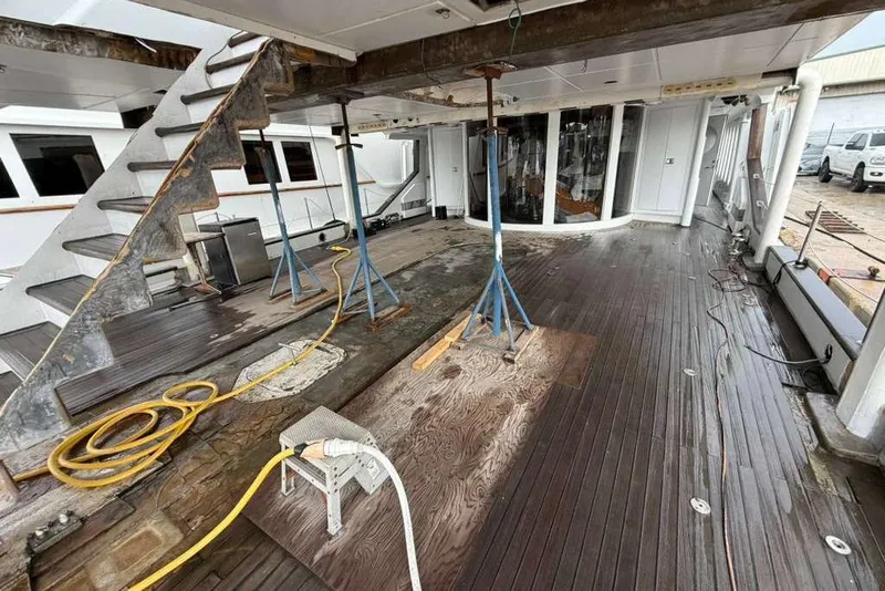 Slide: The Image of 1985 Sterling Yachts 155 Motor Yacht deck under maintenance with tools and equipment. - 35
