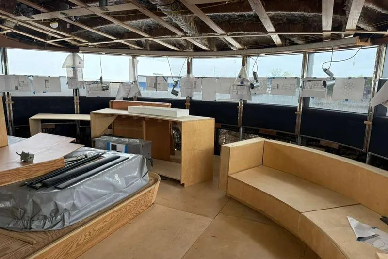 Slide: The Image of Interior renovation of 1985 Sterling Yachts 155 Motor Yacht, featuring unfinished woodwork and seating. - 37