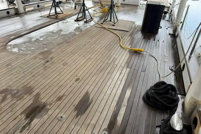 Slide: The Image of Teak deck of 1985 Sterling Yachts 155 Motor Yacht with ropes and equipment. - 38