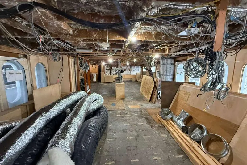 Slide: The Image of Interior renovation of 1985 Sterling Yachts 155 Motor Yacht, showing exposed wiring and ducts. - 40