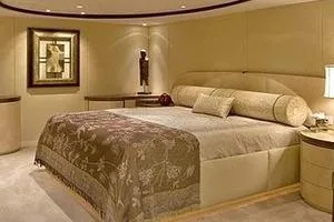 Slide: The Image of Luxurious bedroom interior on 1985 Sterling Yachts 155 Motor Yacht, featuring elegant decor and plush bedding. - 5