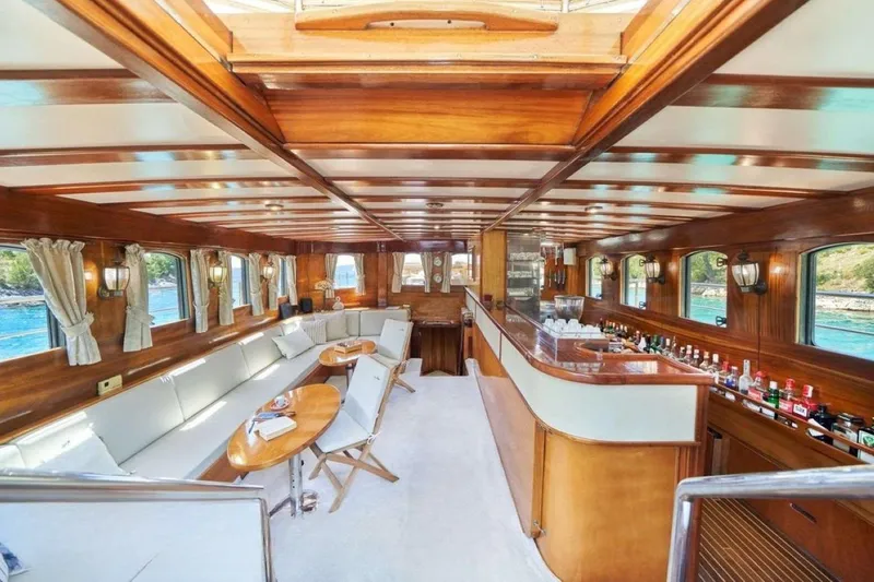 Slide: The Image of Luxurious interior of 1985 Sterling Yachts 155 Motor Yacht with elegant wood finish and bar area. - 6