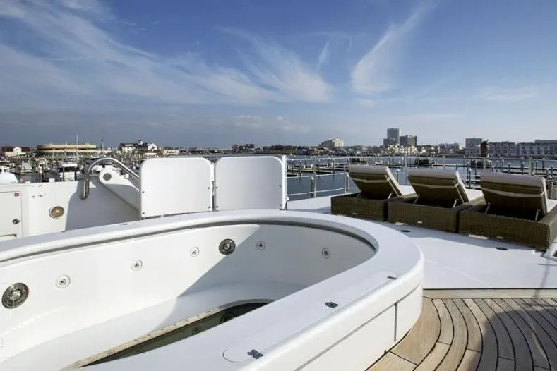 Slide: The Image of Luxurious 1985 Sterling Yachts 155 Motor Yacht deck with jacuzzi and sun loungers. - 8
