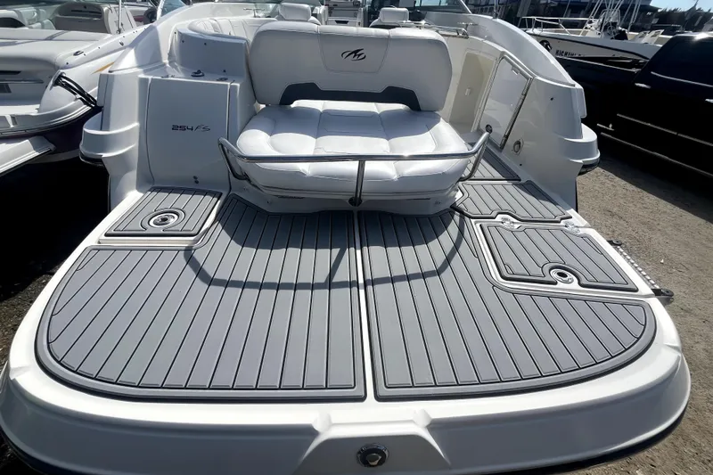 Slide: The Image of 2011 Monterey 254FSC boat with spacious deck and comfortable seating. - 4