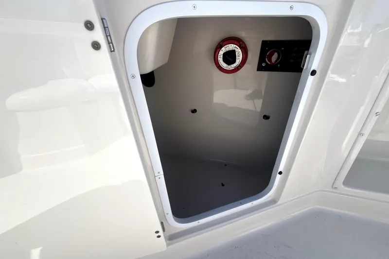 Slide: The Image of Open storage compartment on a 2011 Monterey 254FSC boat. - 16