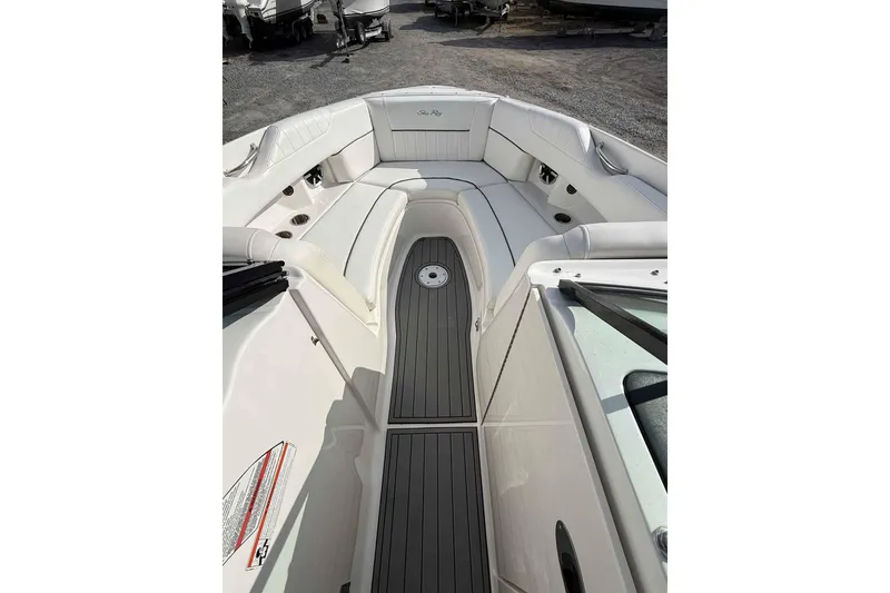 Slide: The Image of 2008 Sea Ray SLX 250 boat interior with white seating and gray flooring. - 5