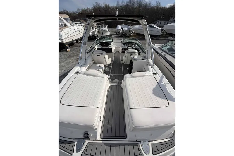 Slide: The Image of 2008 Sea Ray SLX 250 boat interior with white seating and sleek design. - 7