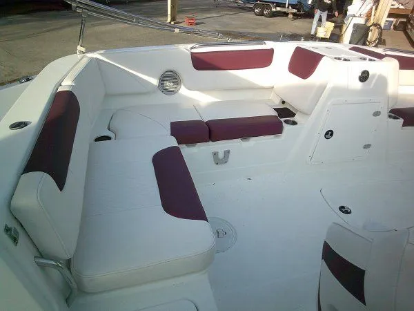 Slide: The Image of Interior of a 2019 Tahoe 1950 Deck boat with white and red seating. - 4