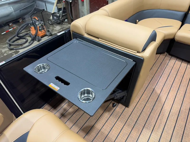 Slide: The Image of Interior of Bentley Pontoons Legacy 200 with foldable table and cup holders. - 25