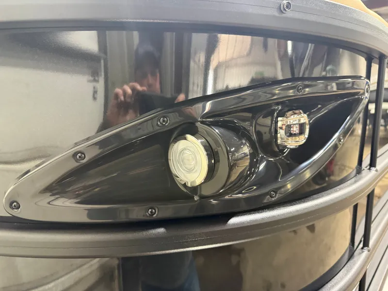 Slide: The Image of Close-up of a 2026 Bentley Pontoons Legacy 200 Navigator headlight. - 33