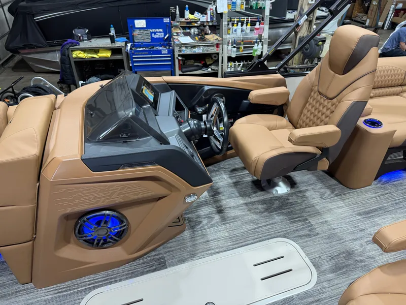 Slide: The Image of Interior of 2025 Tahoe Cascade 2385 Tritoon with luxurious seating. - 11