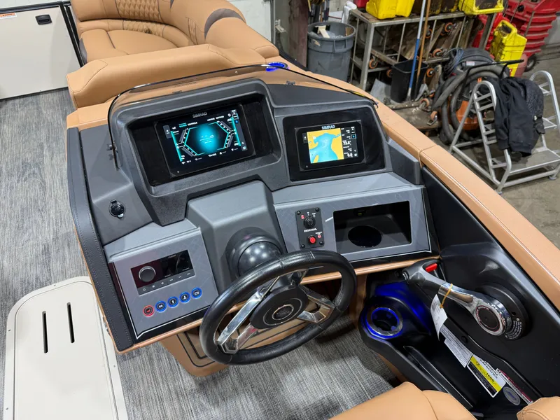 Slide: The Image of Interior view of 2025 Tahoe Cascade 2385 Tritoon helm console. - 13