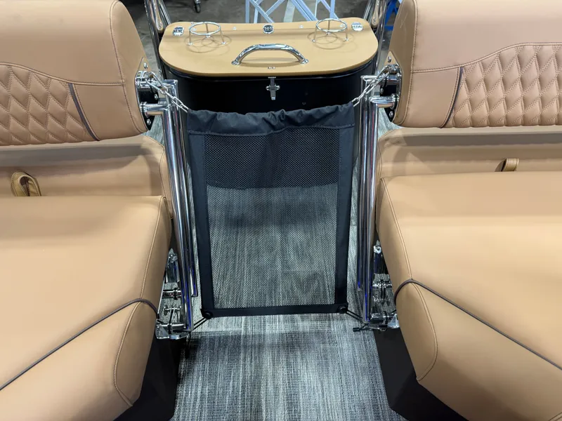 Slide: The Image of Interior of 2025 Tahoe Cascade 2385 Tritoon with beige leather seating. - 22