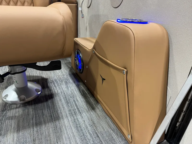 Slide: The Image of Interior of Tahoe Cascade 2385 Tritoon with leather seating and speaker, 2025 model. - 29