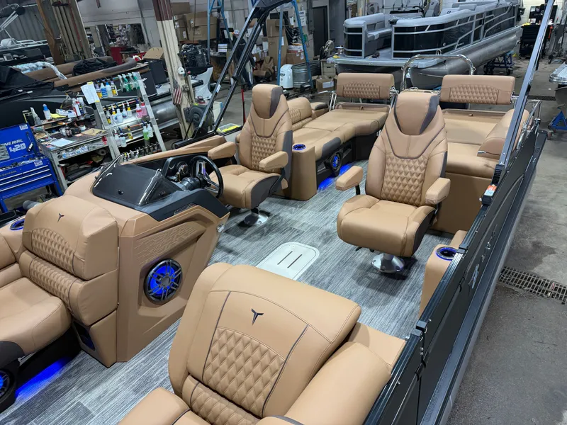 Slide: The Image of Interior of 2025 Tahoe Cascade 2385 Tritoon with luxurious leather seating. - 3