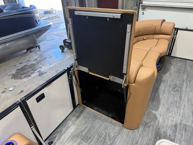 Slide: The Image of Interior of Tahoe Cascade 2385 Tritoon with storage and leather seating. - 31