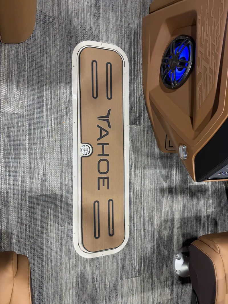 Slide: The Image of 2025 Tahoe Cascade Tritoon interior with speaker and flooring. - 34