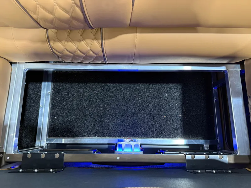 Slide: The Image of Interior of Tahoe Cascade 2385 Tritoon, seat upholstery and storage space. - 36