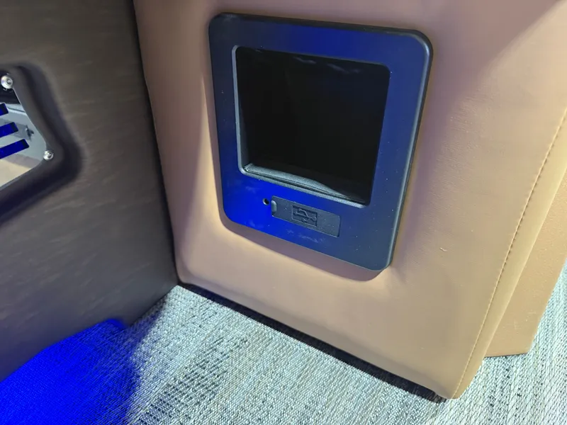 Slide: The Image of Interior of 2025 Tahoe Cascade 2385 Tritoon with blue lighting. - 39